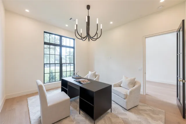 a living room with furniture a ceiling fan and a window