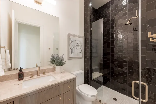 a living room with fireplace furniture and a view of kitchen