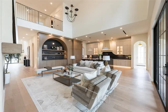 a kitchen with a table chairs sink and cabinets