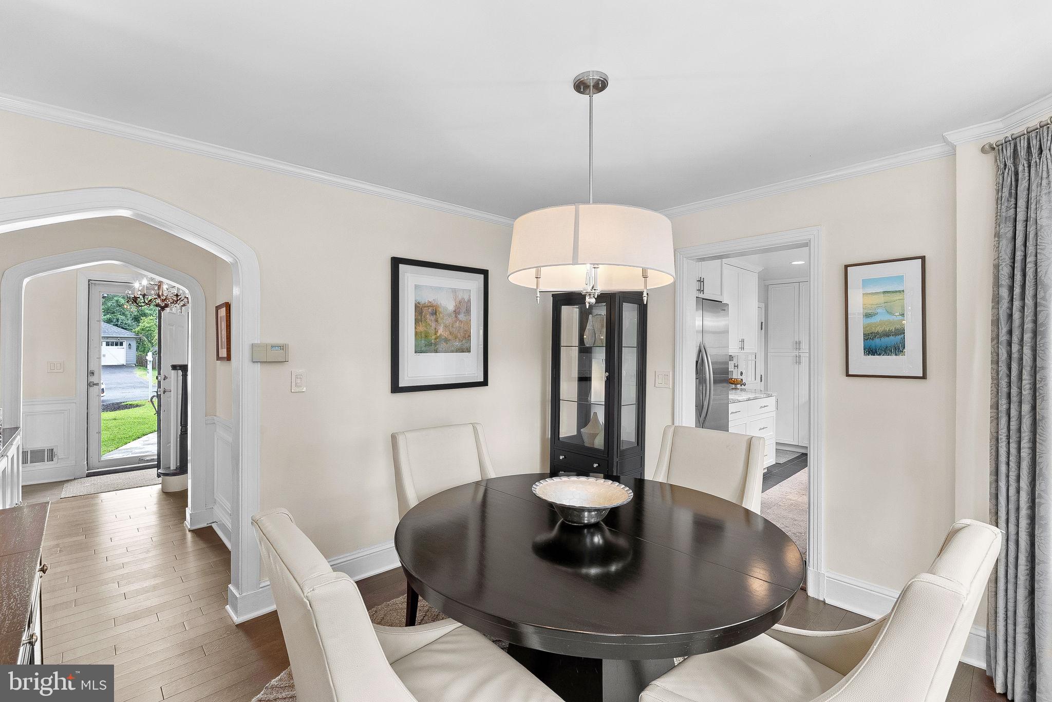 10313 Parkman Road Silver Spring, MD 20903 - Photo 11 of 61 a view of a livingroom with furniture wooden floor a chandelier