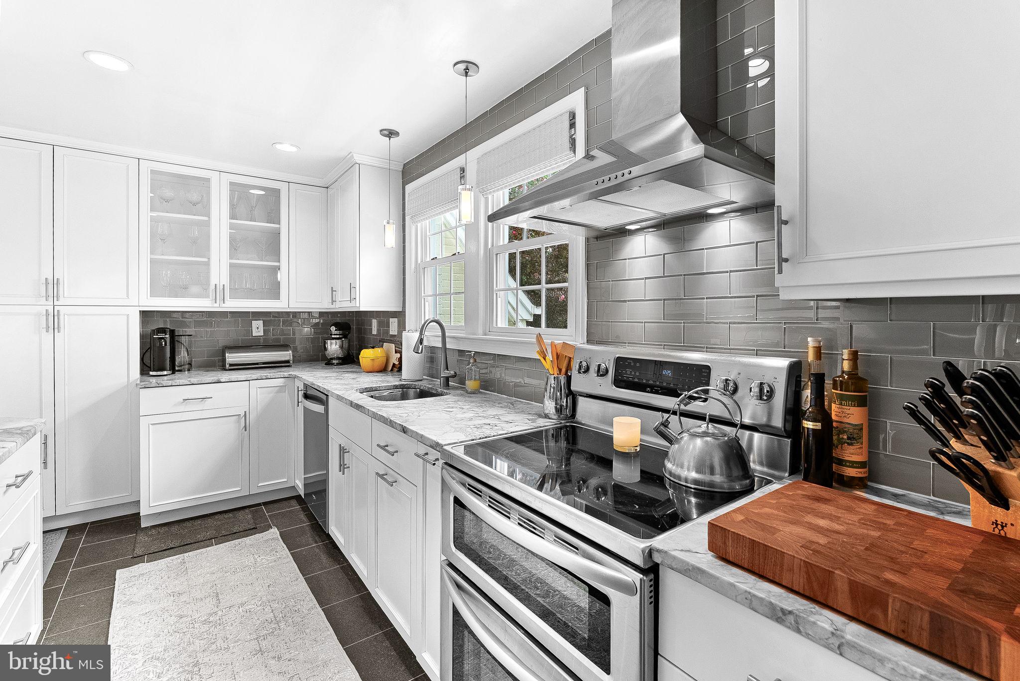 10313 Parkman Road Silver Spring, MD 20903 - Photo 13 of 61 a kitchen with a stove and a sink
