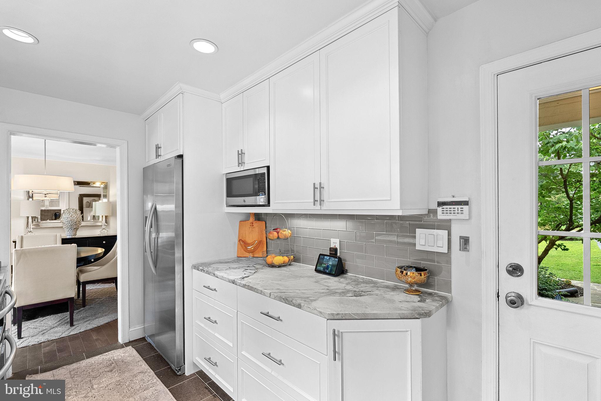 10313 Parkman Road Silver Spring, MD 20903 - Photo 15 of 61 a kitchen with stainless steel appliances granite countertop a refrigerator sink and stove