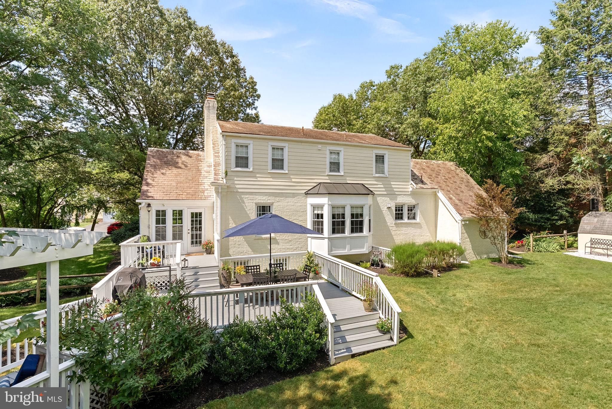 10313 Parkman Road Silver Spring, MD 20903 - Photo 2 of 61 a front view of a house with a yard
