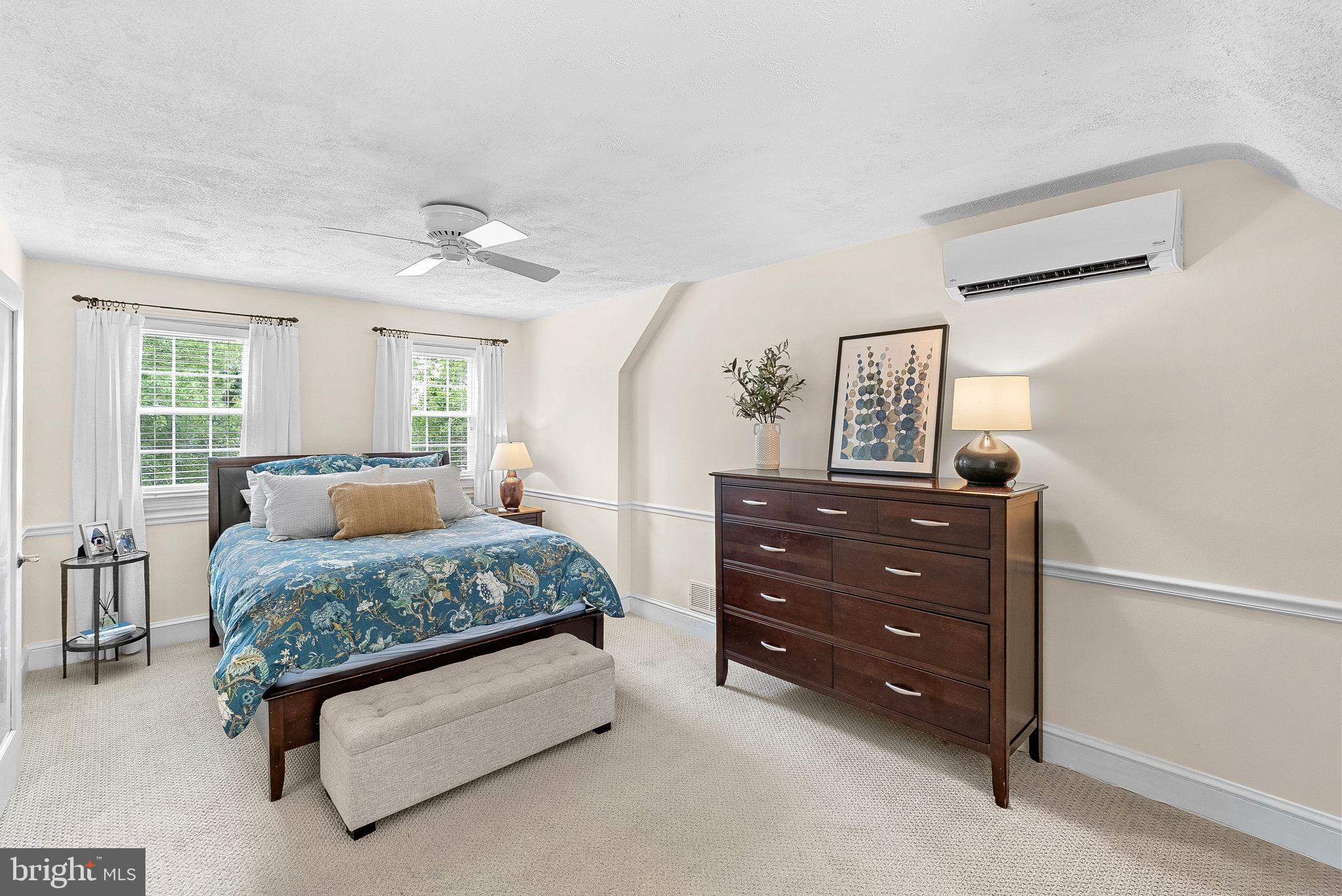 10313 Parkman Road Silver Spring, MD 20903 - Photo 28 of 61 a bedroom with a bed and wooden floor