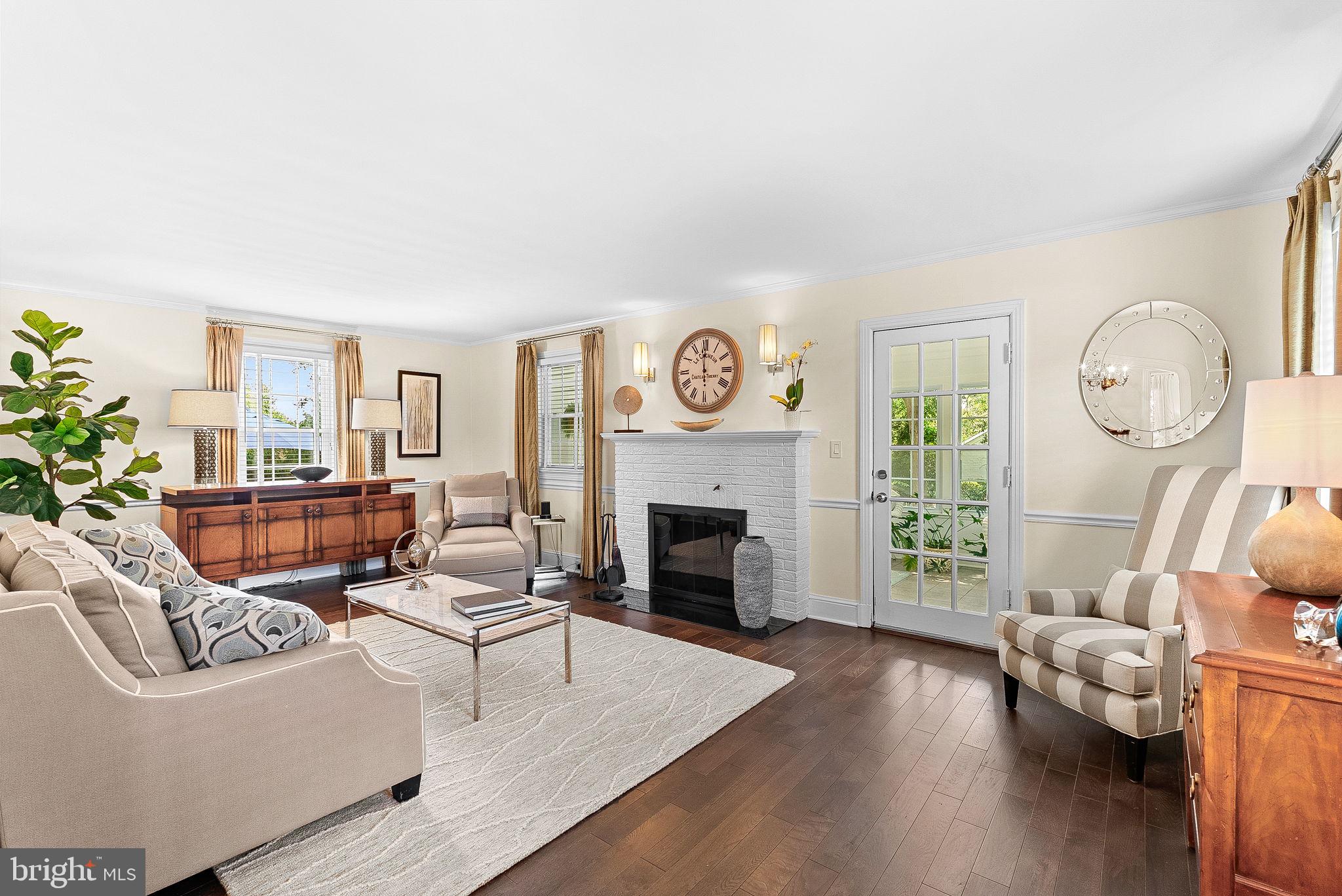 10313 Parkman Road Silver Spring, MD 20903 - Photo 3 of 61 a living room with furniture and a fireplace
