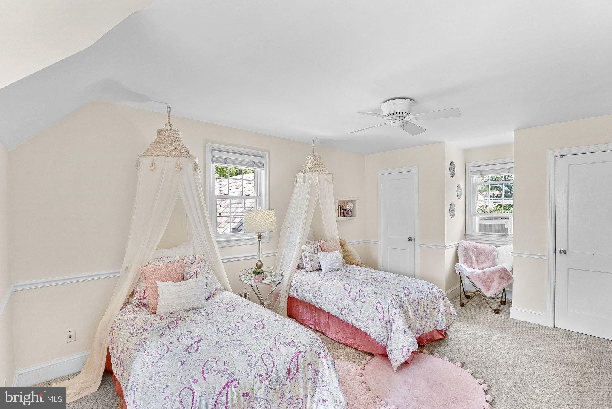 10313 Parkman Road Silver Spring, MD 20903 - Photo 32 of 61 a bedroom with two beds and a window