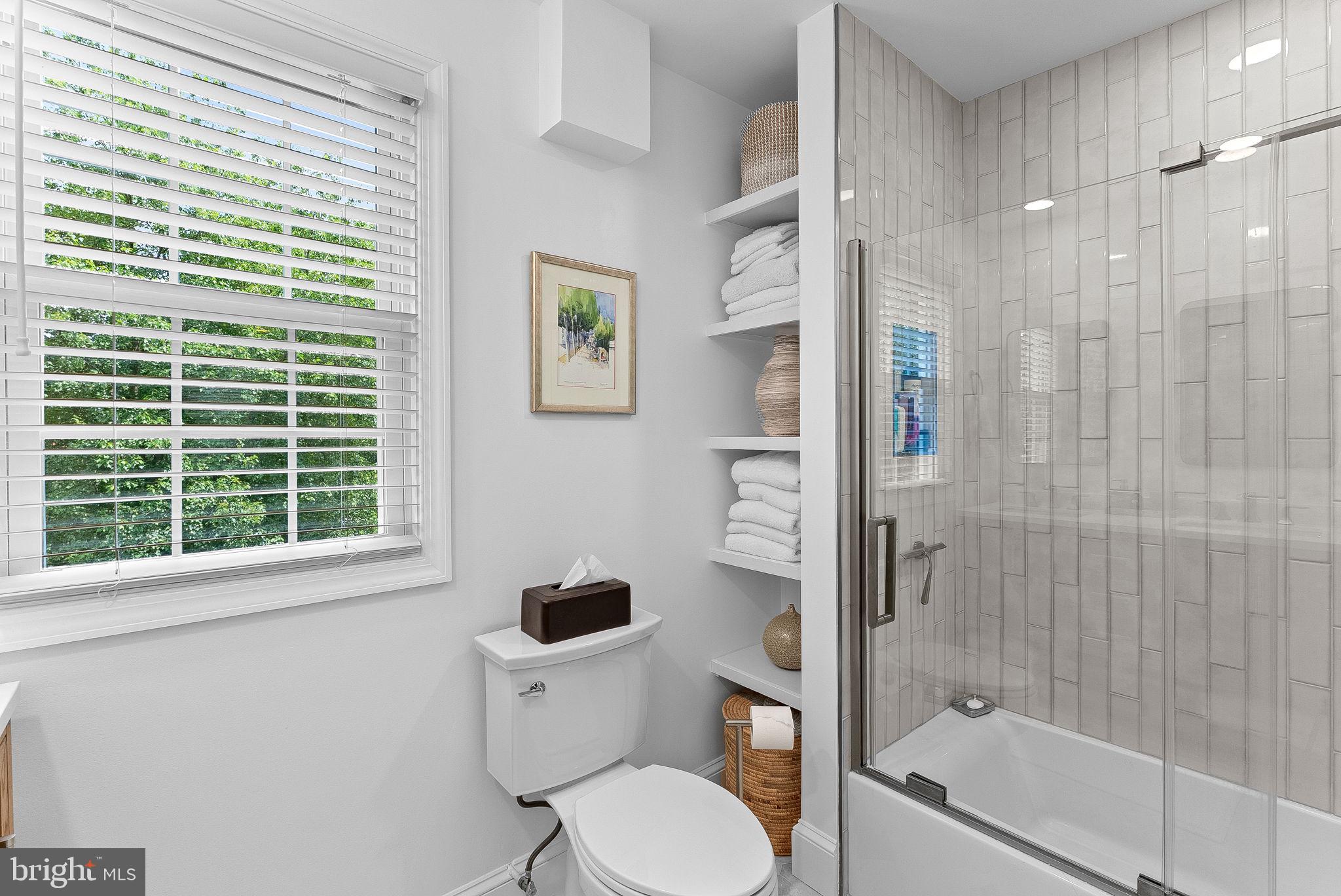 10313 Parkman Road Silver Spring, MD 20903 - Photo 35 of 61 a bathroom with a toilet and a shower