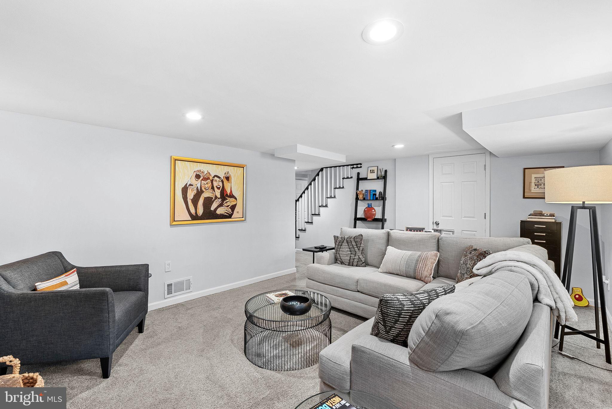 10313 Parkman Road Silver Spring, MD 20903 - Photo 39 of 61 a living room with furniture and a couch