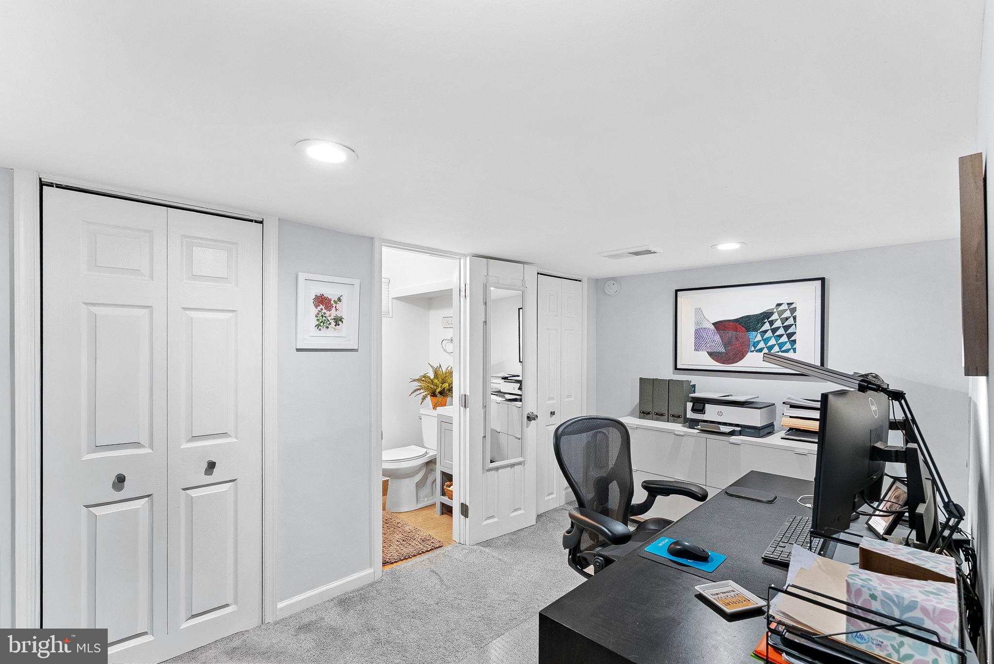 10313 Parkman Road Silver Spring, MD 20903 - Photo 40 of 61 a view of a workspace with furniture and a window