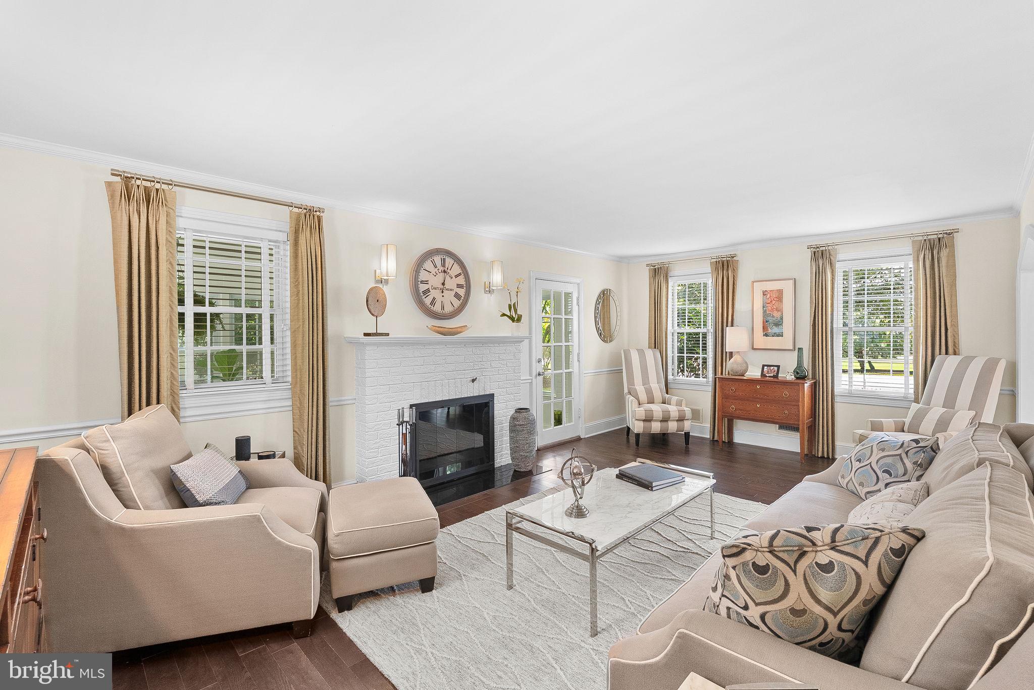 10313 Parkman Road Silver Spring, MD 20903 - Photo 4 of 61 a living room with furniture and a fireplace