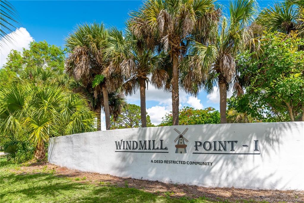 255 Southwest Homeland Road Port St. Lucie, FL 34953 - Photo 15 of 15 a view of outdoor space with signage and flags