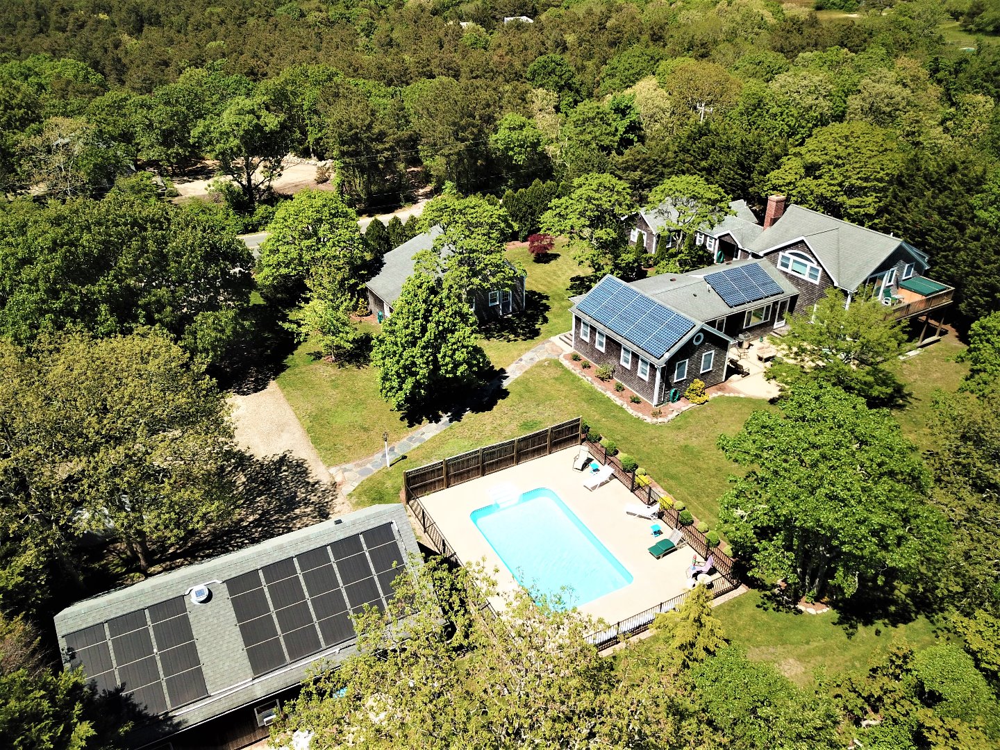 16 Meshacket Road Edgartown, MA 02539 - Photo 1 of 41 an aerial view of a house with yard swimming pool and outdoor seating