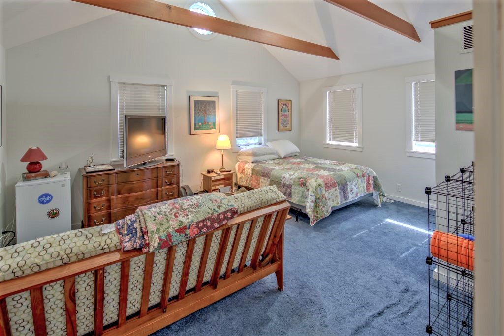 16 Meshacket Road Edgartown, MA 02539 - Photo 13 of 41 a bedroom with two beds and a dresser