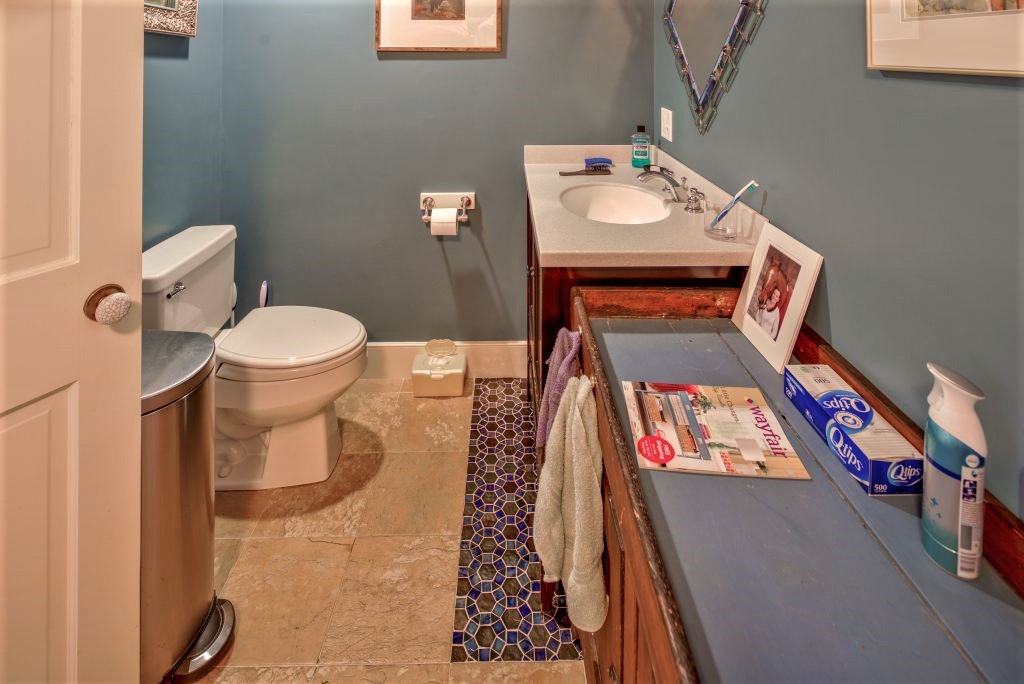 16 Meshacket Road Edgartown, MA 02539 - Photo 16 of 41 a bathroom with a toilet and a mirror