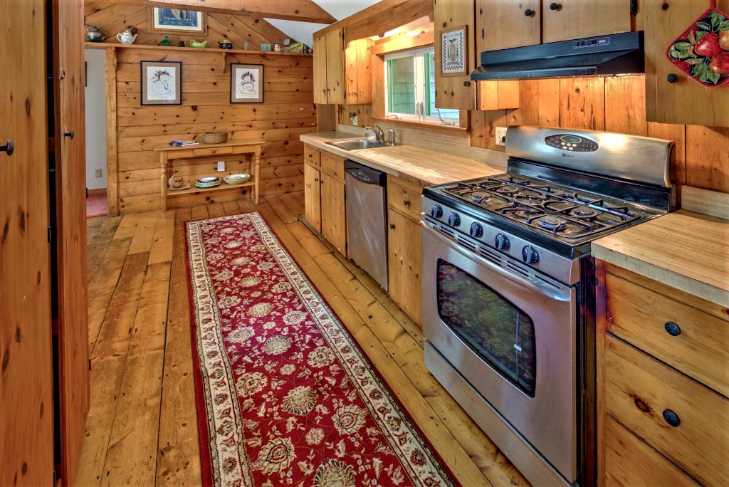 16 Meshacket Road Edgartown, MA 02539 - Photo 19 of 41 a kitchen with stainless steel appliances granite countertop a stove and a sink