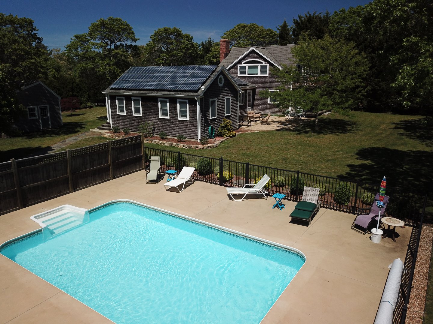 16 Meshacket Road Edgartown, MA 02539 - Photo 2 of 41 an aerial view of a house with swimming pool and patio