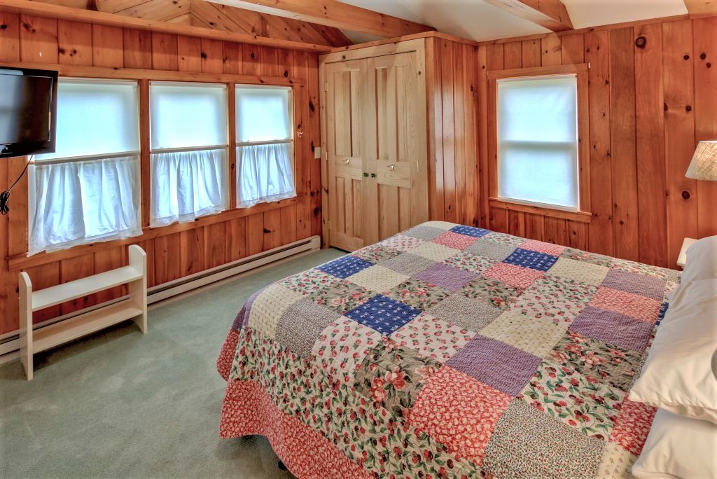 16 Meshacket Road Edgartown, MA 02539 - Photo 21 of 41 a bedroom with a bed and a window
