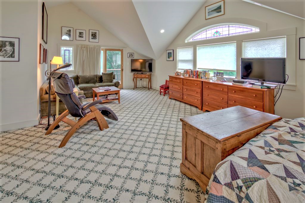 16 Meshacket Road Edgartown, MA 02539 - Photo 25 of 41 a room with furniture a flat screen tv and a table