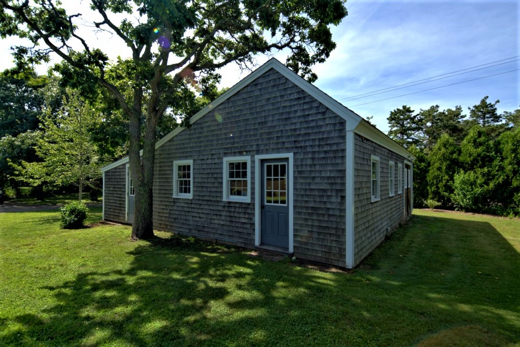 16 Meshacket Road Edgartown, MA 02539 - Photo 30 of 41 a front view of a house with garden