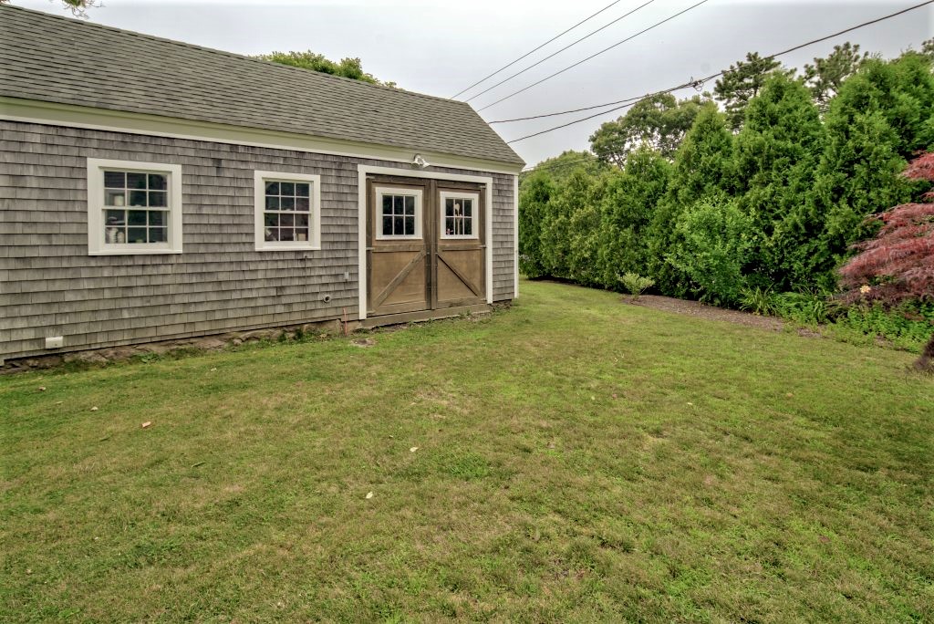 16 Meshacket Road Edgartown, MA 02539 - Photo 31 of 41 a view of a backyard of the house