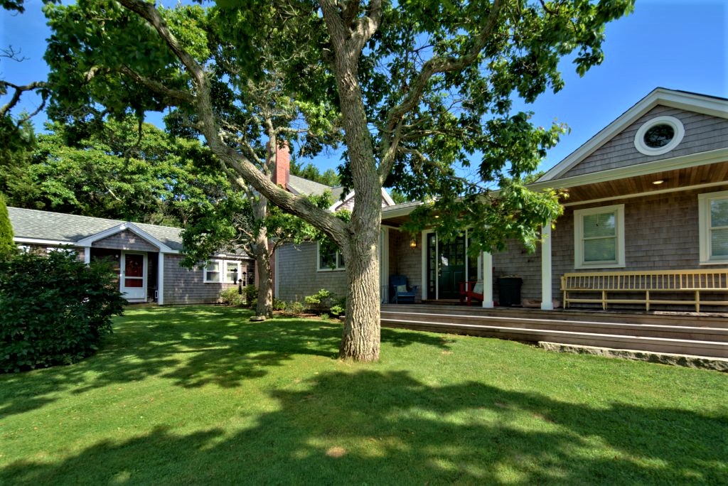 16 Meshacket Road Edgartown, MA 02539 - Photo 35 of 41 a front view of a house with a yard
