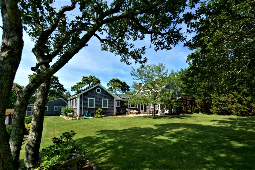 16 Meshacket Road Edgartown, MA 02539 - Photo 37 of 41 a front view of a house with garden