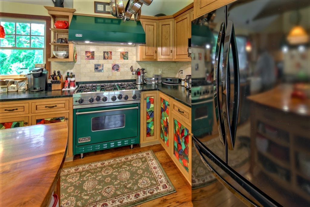 16 Meshacket Road Edgartown, MA 02539 - Photo 8 of 41 a kitchen with stainless steel appliances granite countertop a stove a sink and a refrigerator