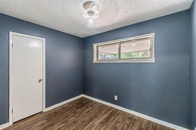 a view of room with wooden floor