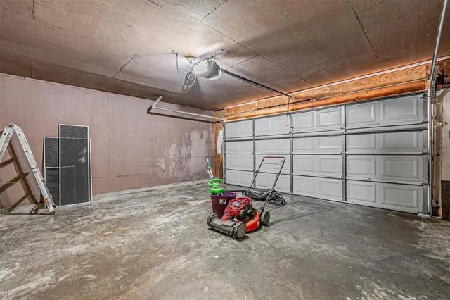 a view of a garage with parked cars