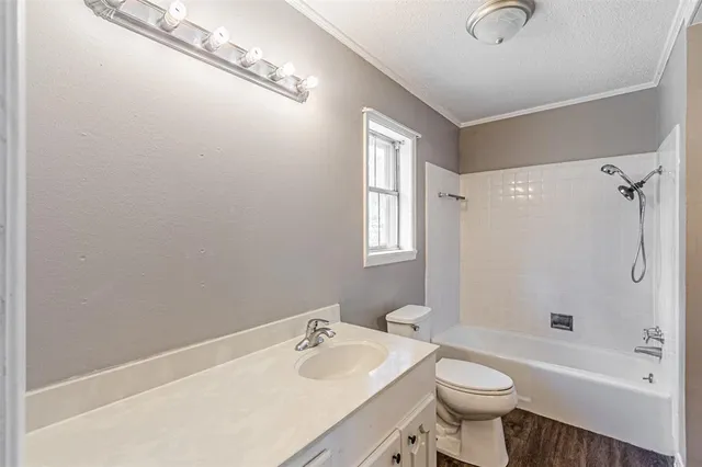 a bathroom with a sink toilet a bathtub and shower