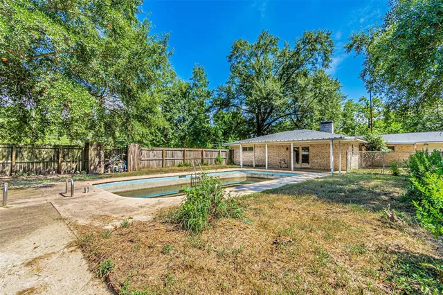 a backyard of a house with lots of green space