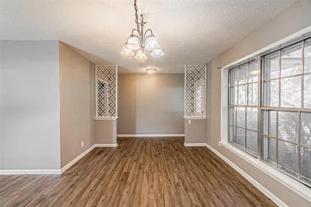 a view of livingroom with hardwood floor and hallway