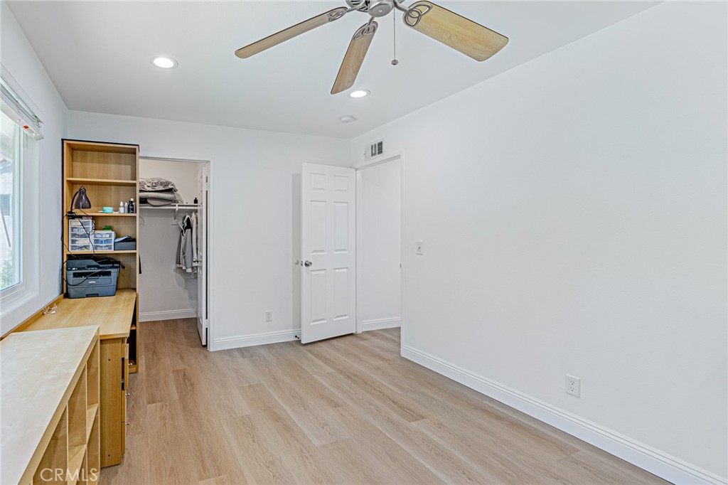 25533 Longfellow Place Stevenson Ranch, CA 91381 - Photo 28 of 47 a view of livingroom with hardwood floor and a ceiling fan