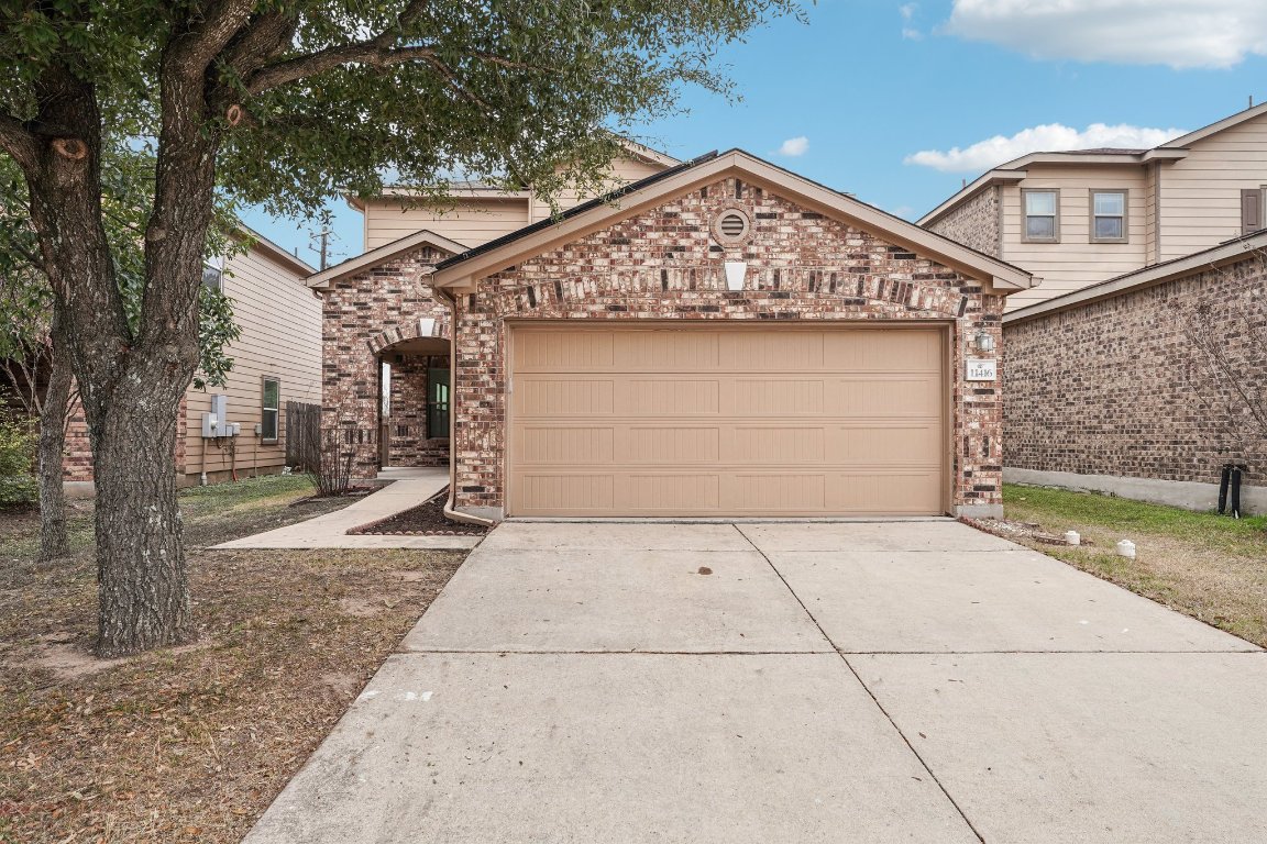a front view of a house with a garage