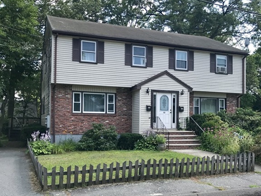 33 Clark Street, Unit A Randolph, MA 02368 - Photo 1 of 15 a front view of a house with a garden
