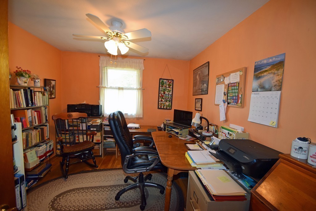 33 Clark Street, Unit A Randolph, MA 02368 - Photo 11 of 15 a view of a workspace with furniture and a window