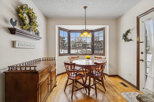 a view of a dining room with furniture window and outside view