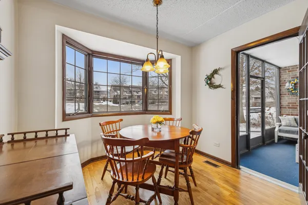 a dining room with furniture and window