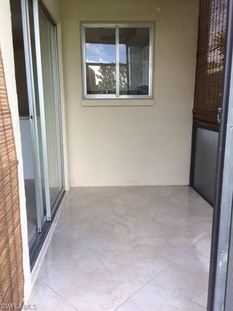 3655 Boca Ciega Drive, Unit 102 Naples, FL 34112 - Photo 16 of 27 a view of an empty room with a window