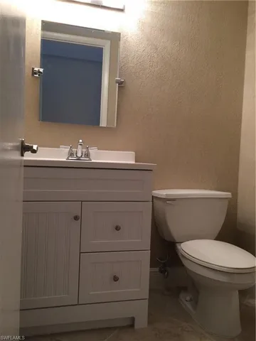 a bathroom with a shower and a toilet