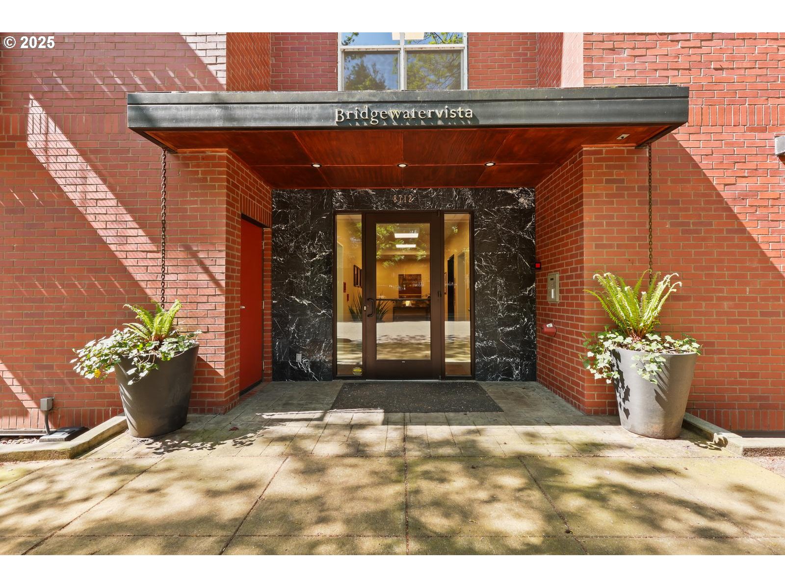 8712 North Decatur Street, Unit 105 Portland, OR 97203 - Photo 3 of 38 a view of a entryway door with potted plants