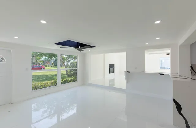 a kitchen with a sink appliances and cabinets