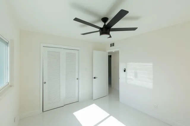 a large kitchen with cabinets and stainless steel appliances