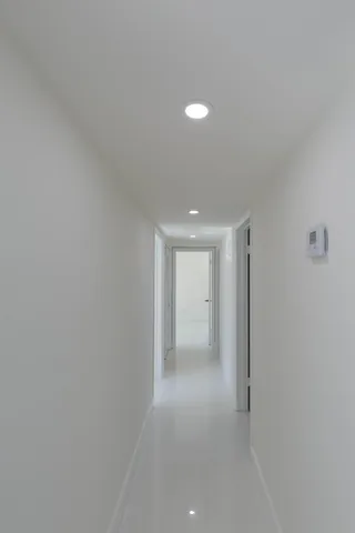 a kitchen with stainless steel appliances granite countertop a sink and a stove