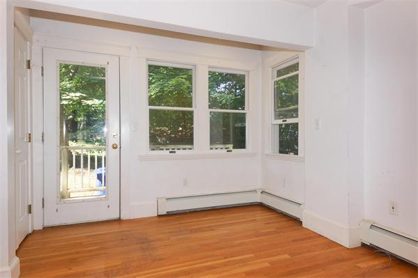 7 Burr Road Newton, MA 02459 - Photo 5 of 13 a view of an empty room with wooden floor and a window