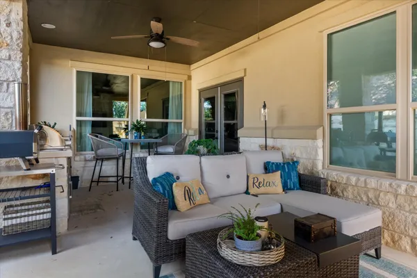 a outdoor space with patio couch and a potted plant