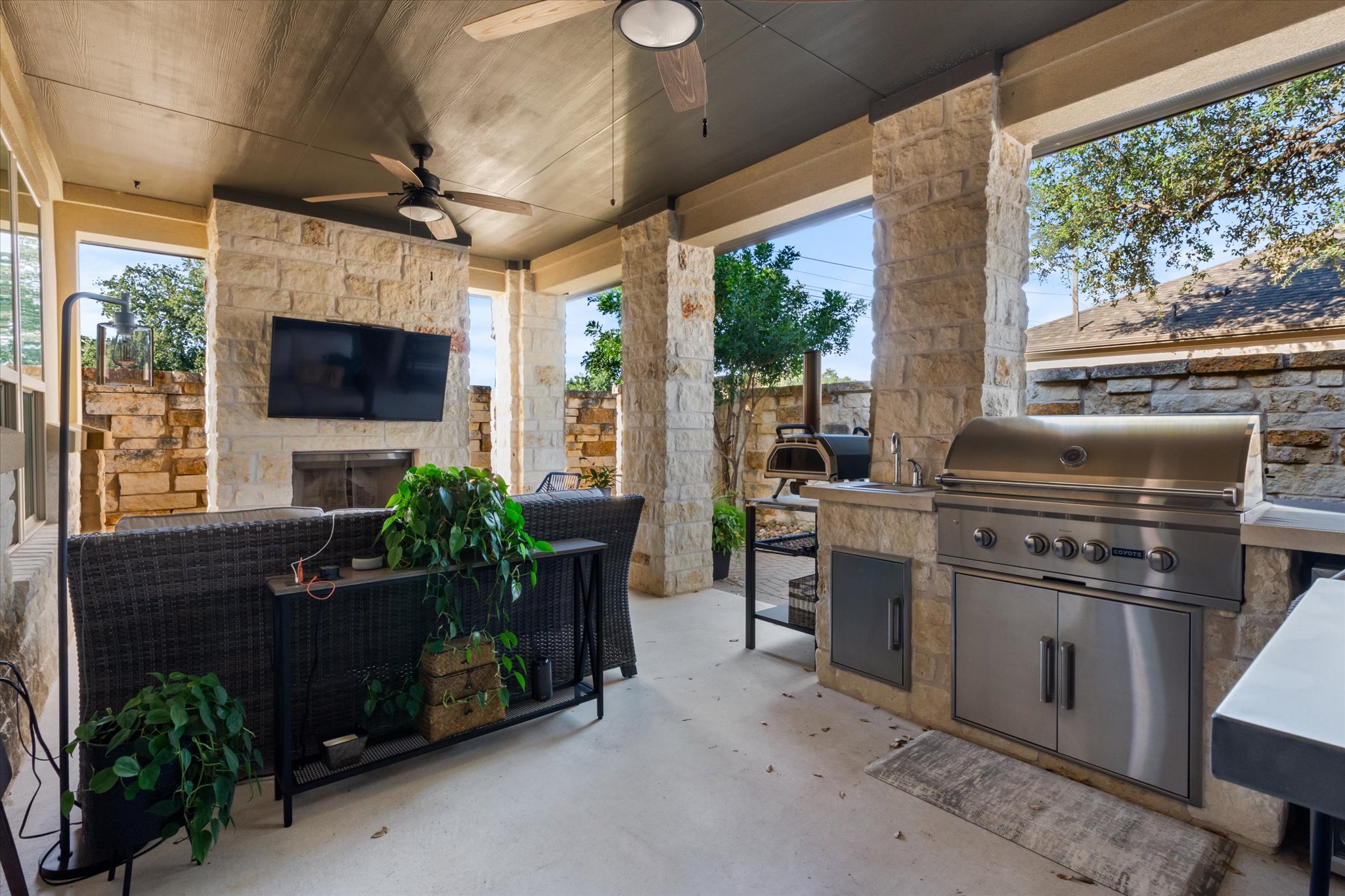 549 Clubhouse Drive, Unit G Georgetown, TX 78628 - Photo 25 of 35 a living room with furniture a flat screen tv and a floor to ceiling window
