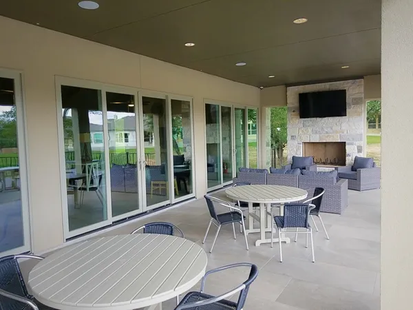 a dinning table and chairs in a patio