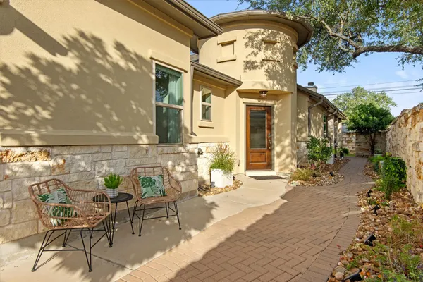 a view of a chairs and table in the patio
