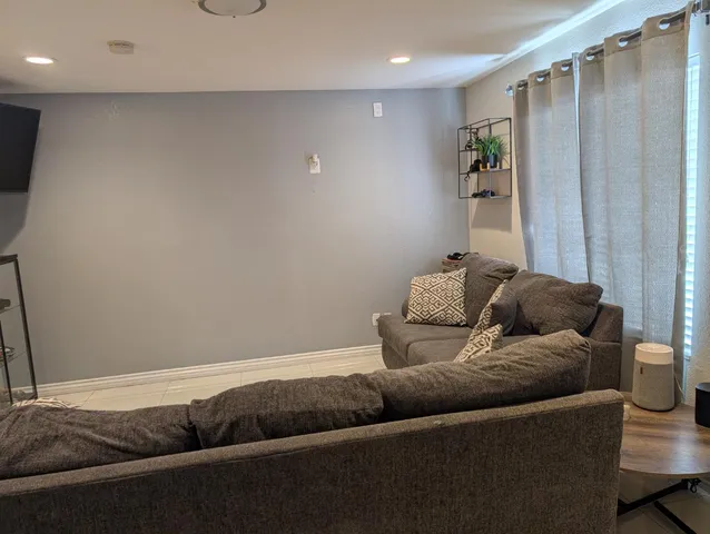 a living room with furniture and a couch